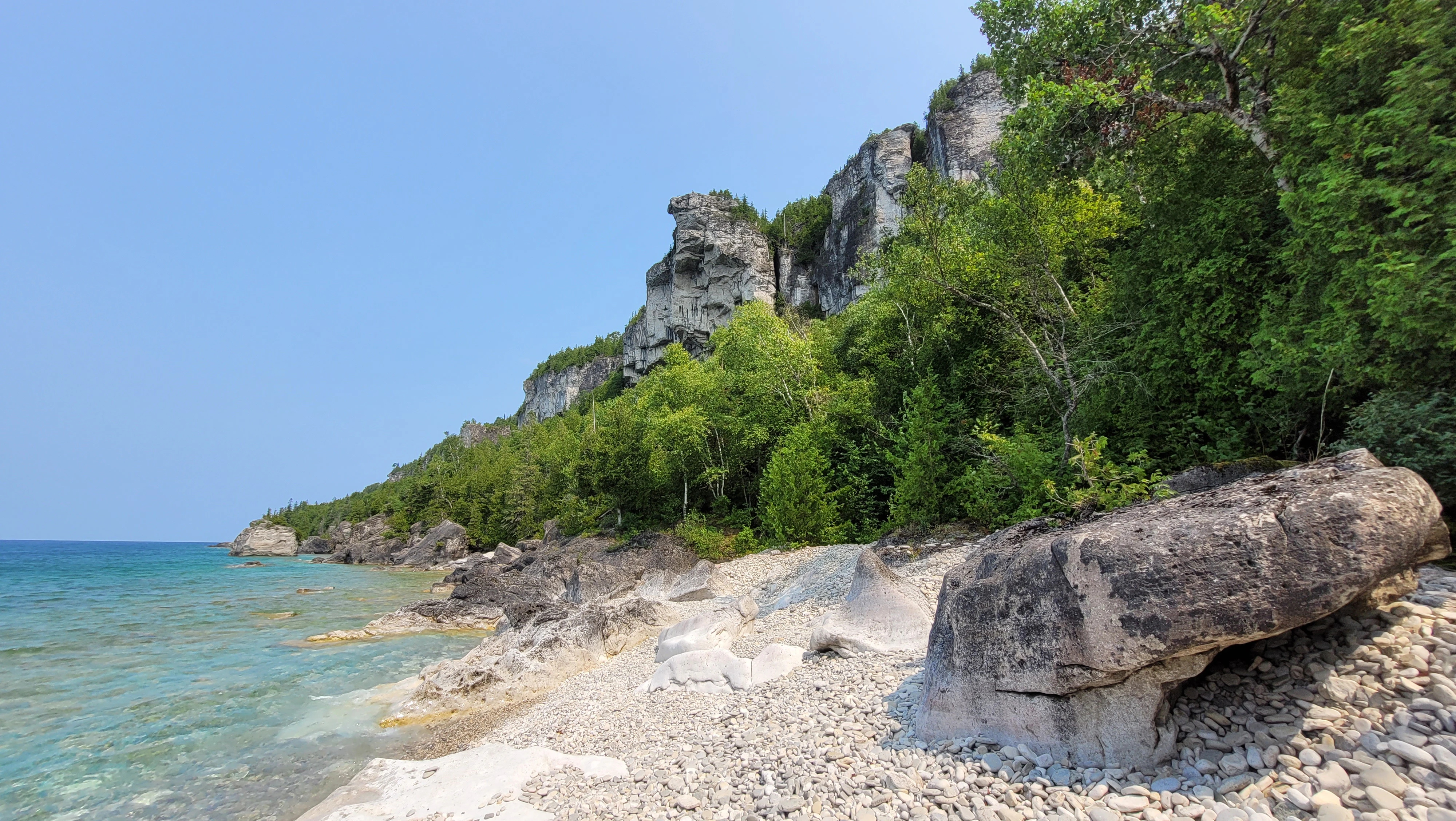 The white limestone cliffs of the Niagra Enscarpment along the shores of Lion's Head Ontario in the Bruce Peninsula