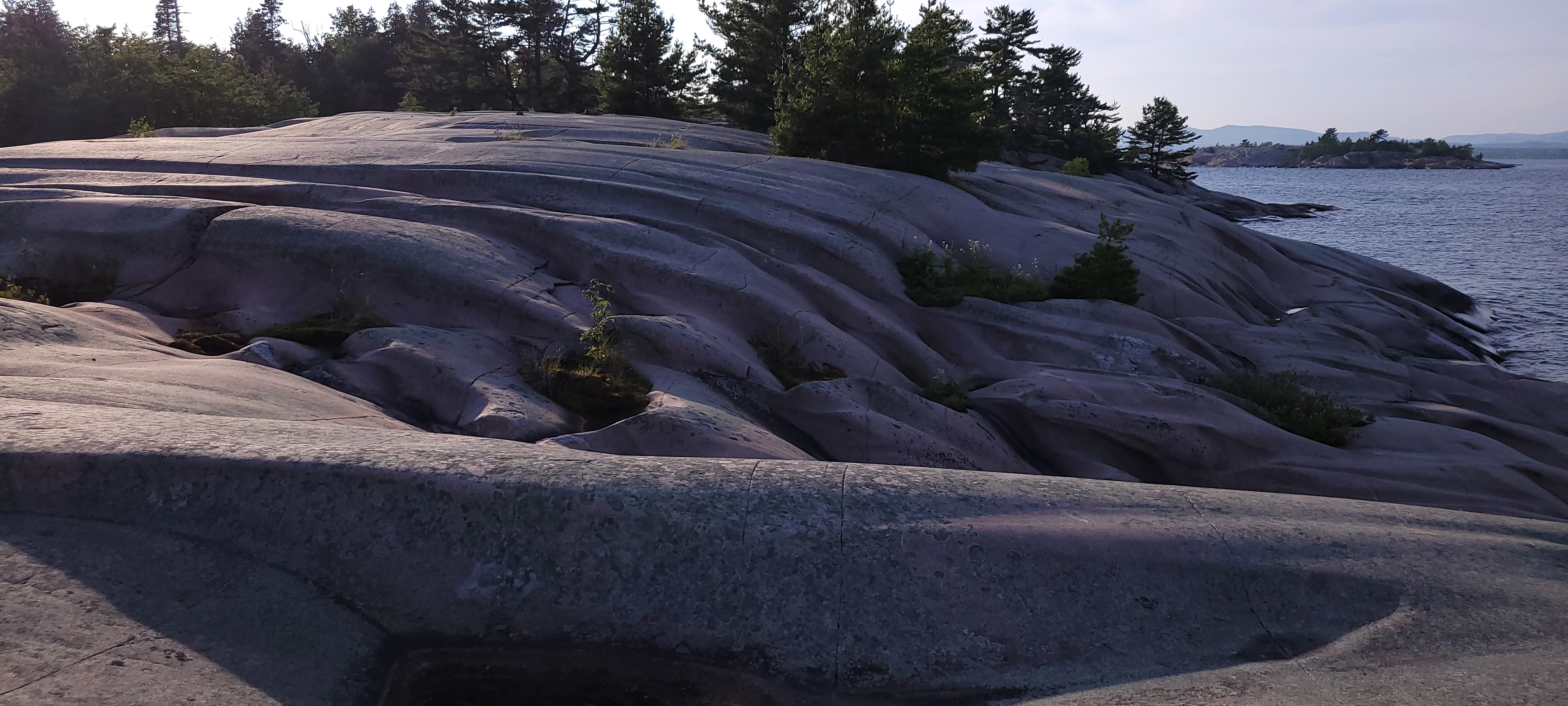 Wave shaped rock formations on West Fox Island in the Georgian Bay near Killarney, Ontario, Canada