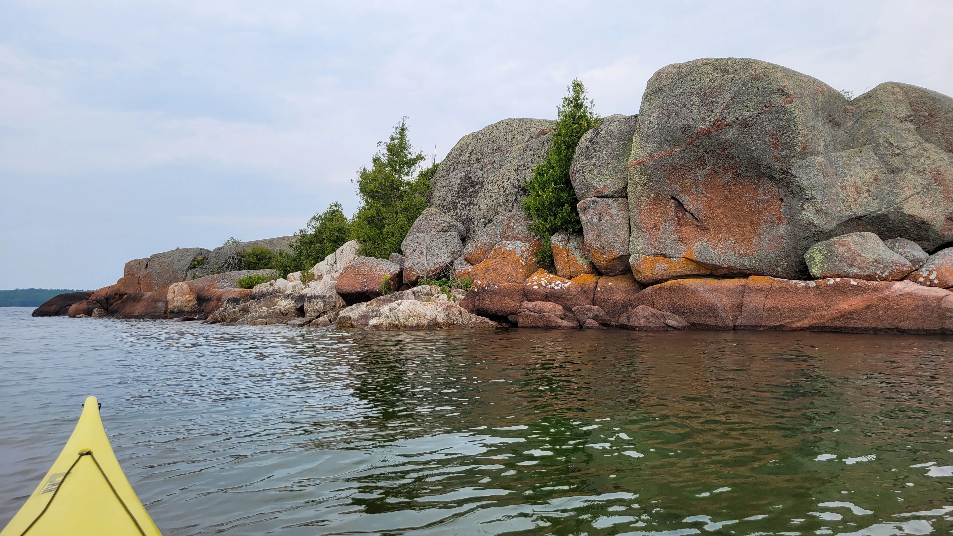 An incredible colorful vista of cliffs, islands and pine trees from North Benjamin Island in Northern Ontrario, Canada