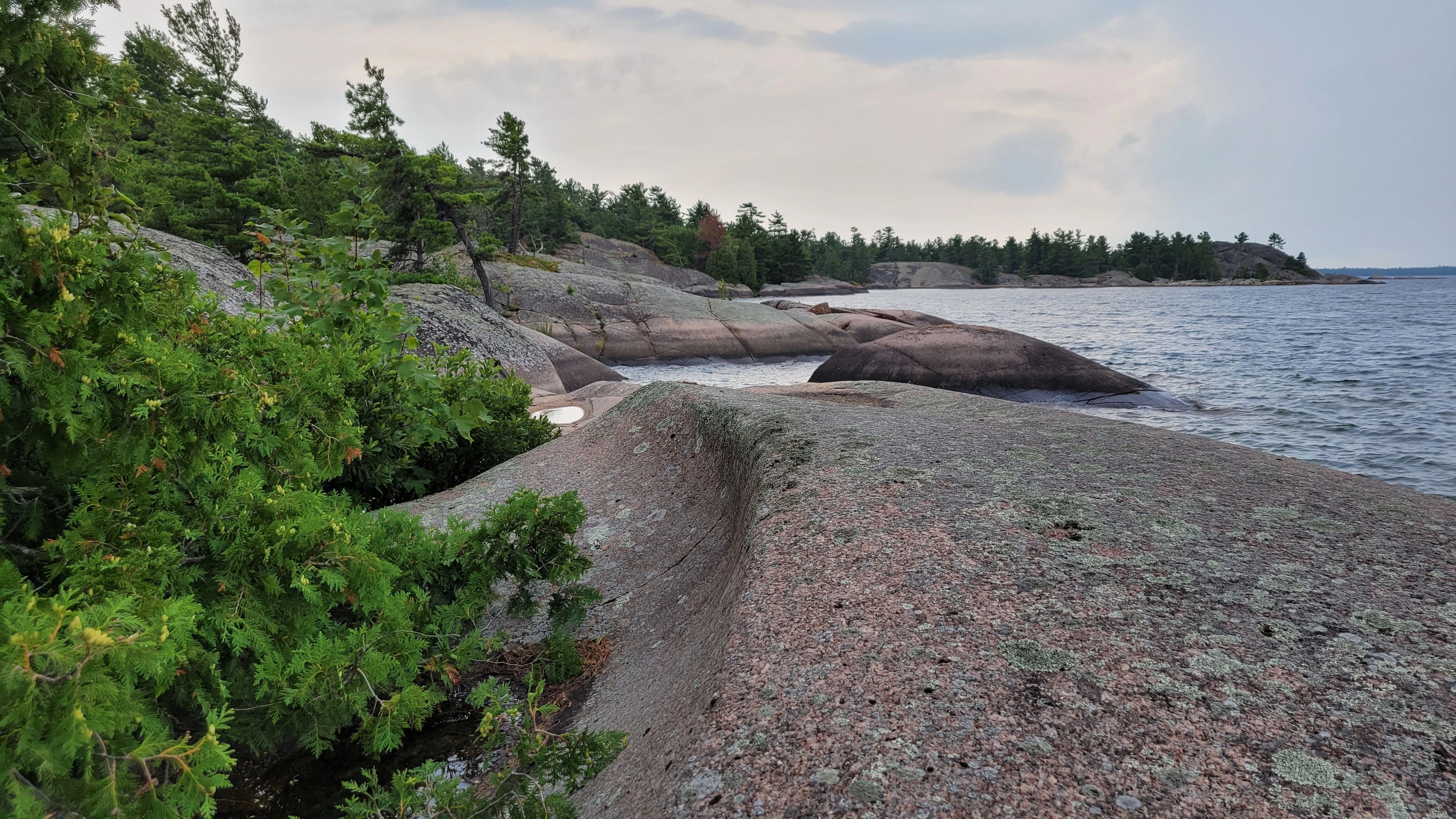 A metamorphic red and pink granite rock on the shore of North Benjamin Island in Northern Ontrario, Canada