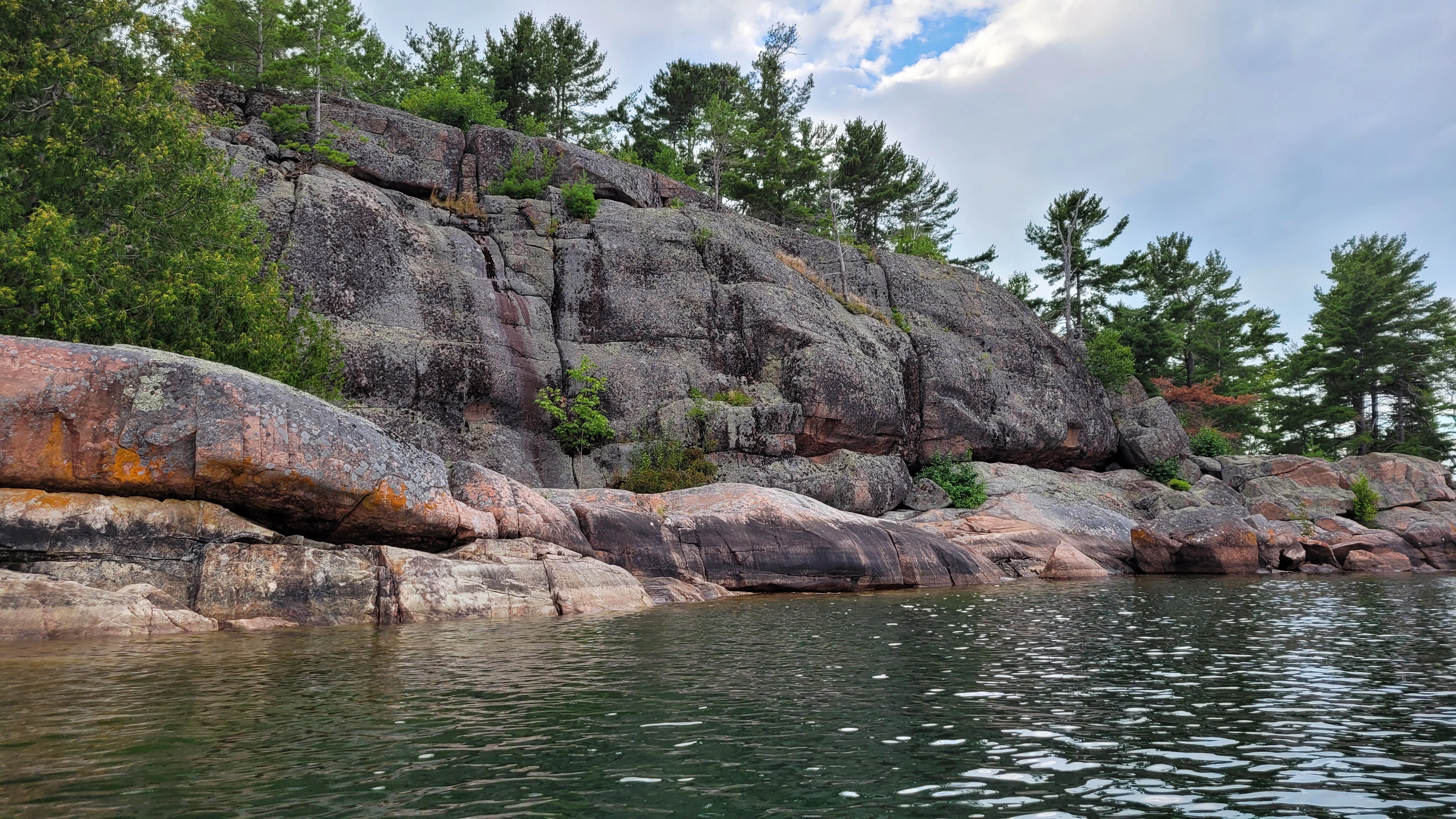 A colorful island with reds, whites and oranges near the Benjamin Islands in Northern Ontrario, Canada