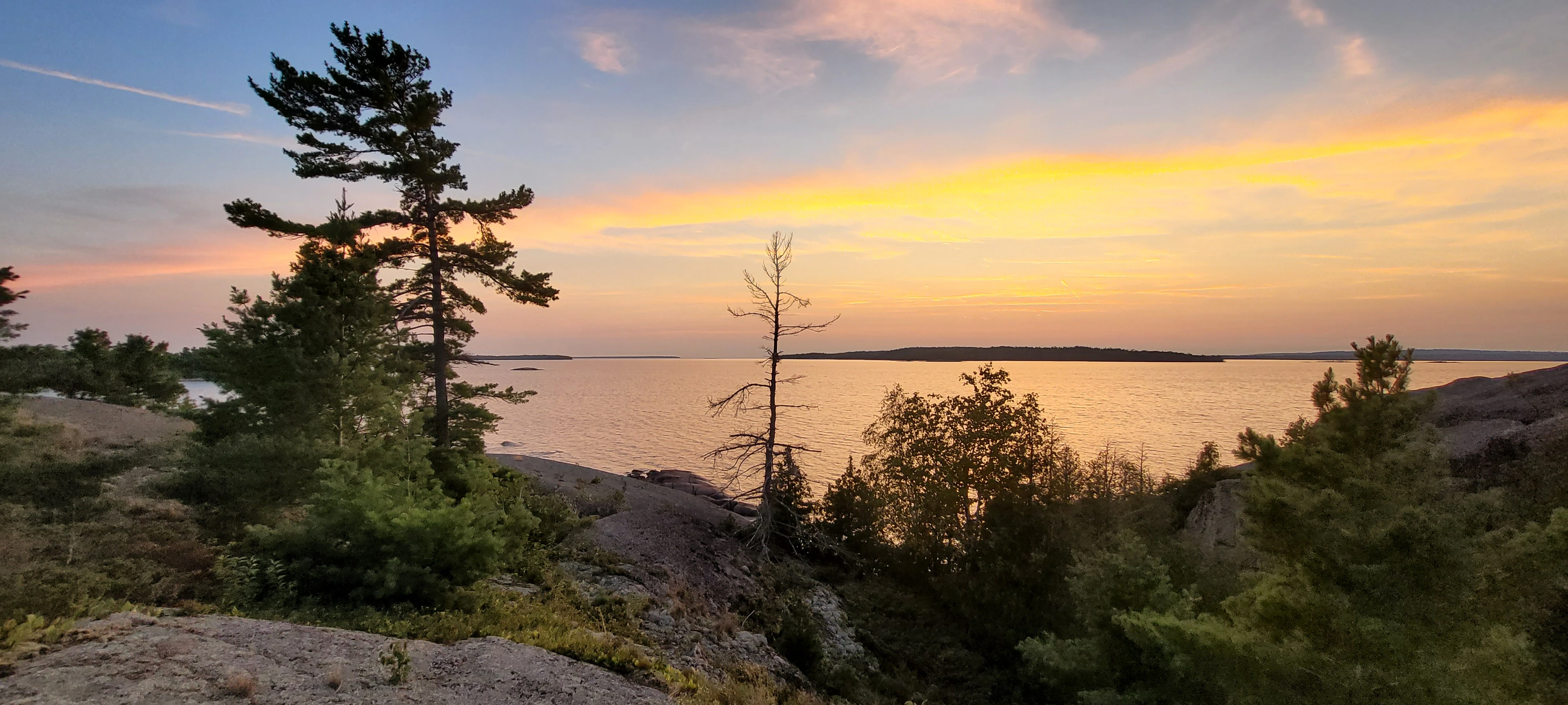 A smooth, wave shaped granite shoreline on North Benjamin Island in Northern Ontrario, Canada