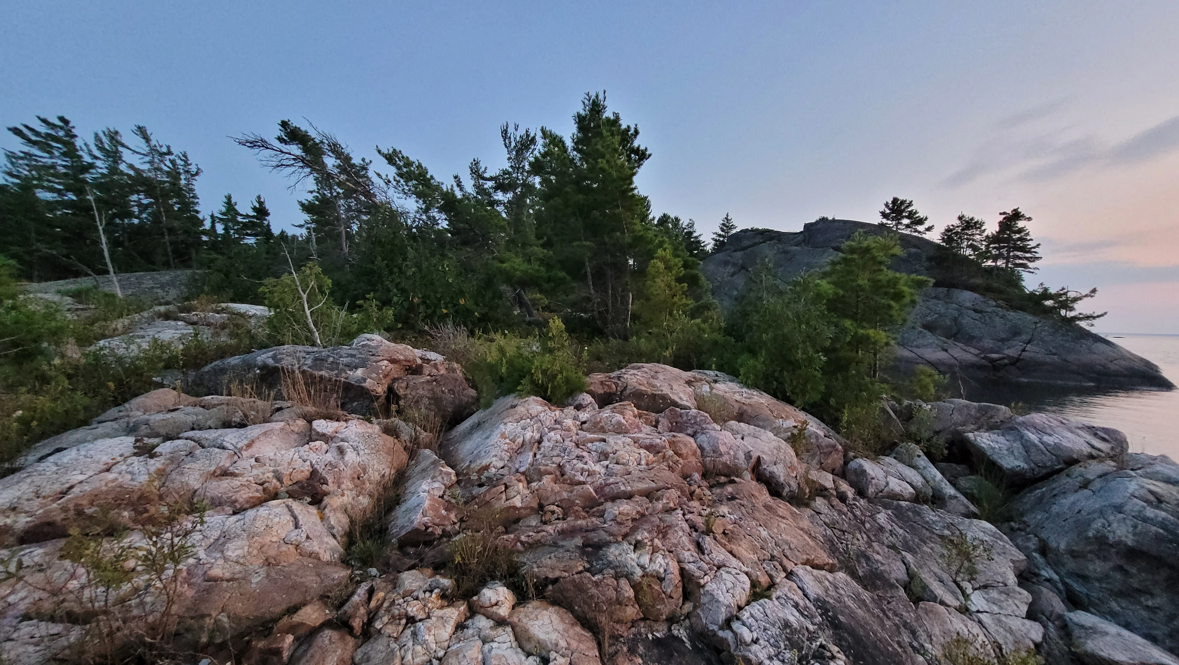 White quartzite and a smooth, round granite cliff on the Benjamin Islands in Northern Ontrario, Canada
