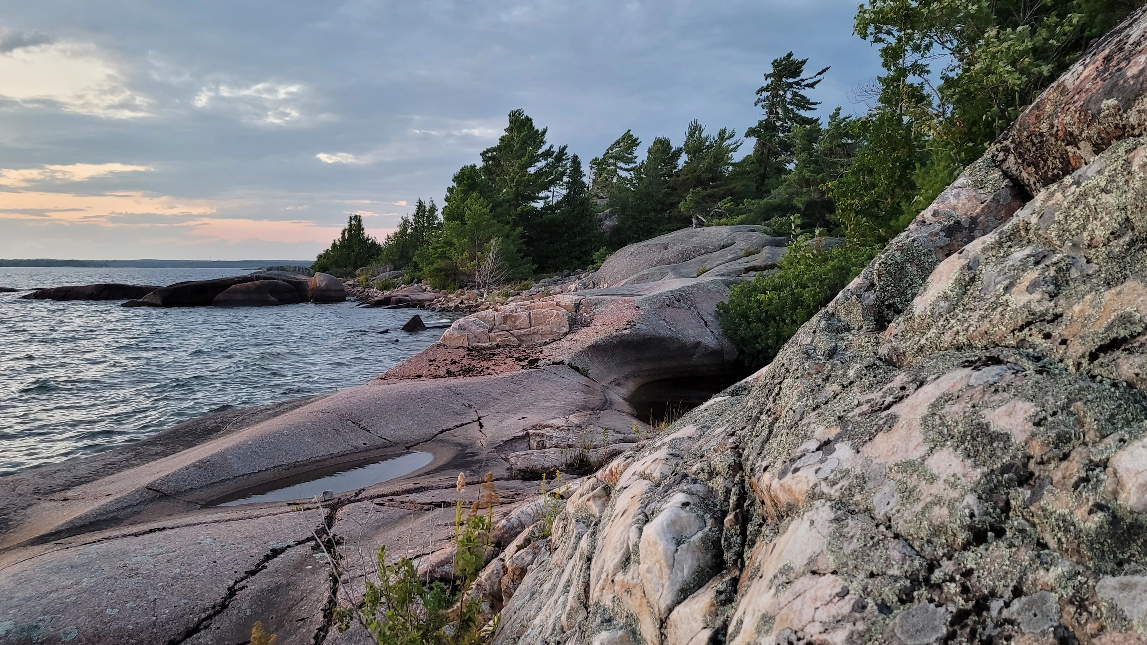 White quartzite islands next to smooth red granite islands near the Benjamin Islands in Northern Ontrario, Canada