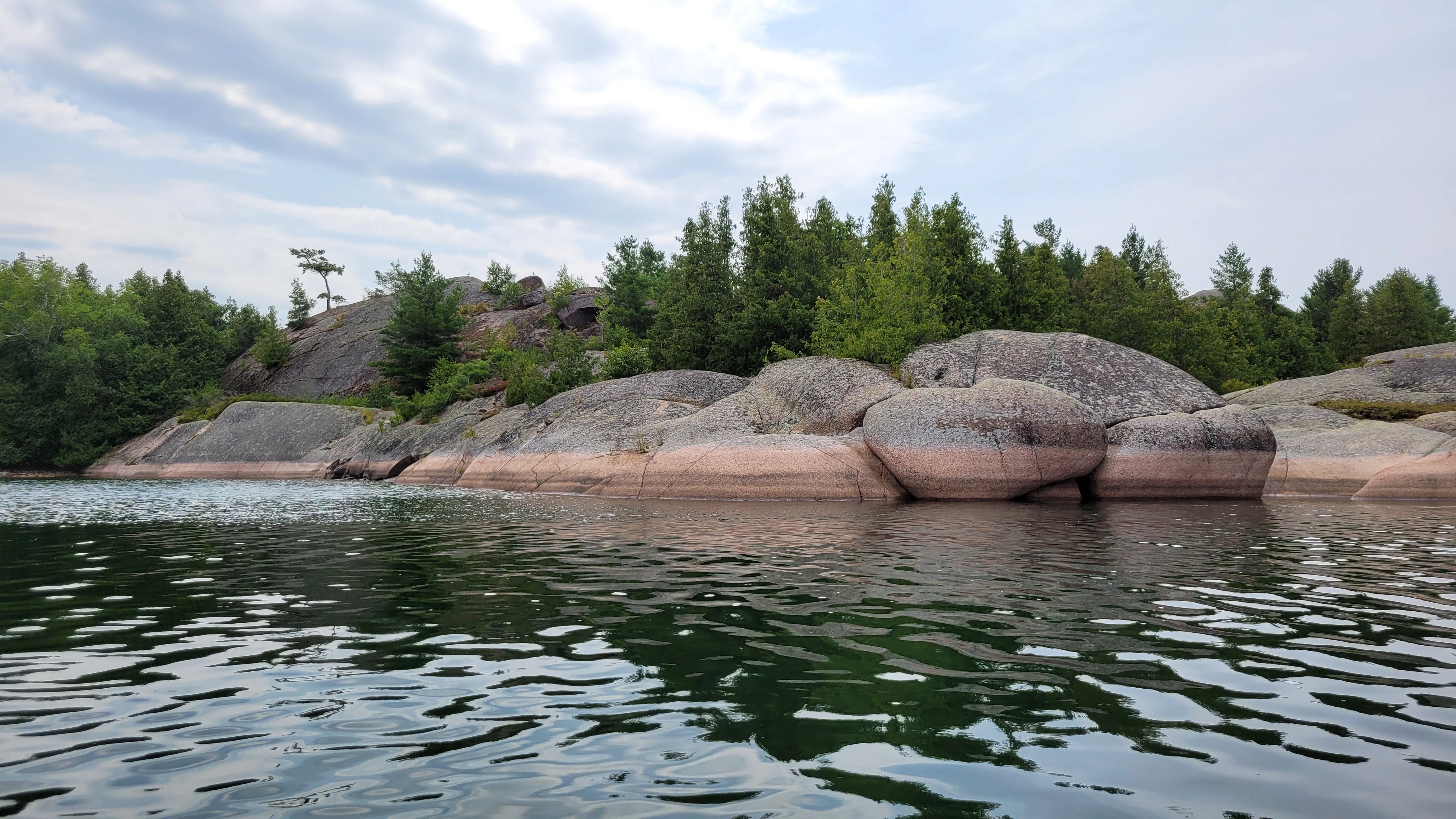 White, red and pink metamorphic, igneous rocks on North Benjamin Island in Northern Ontrario, Canada