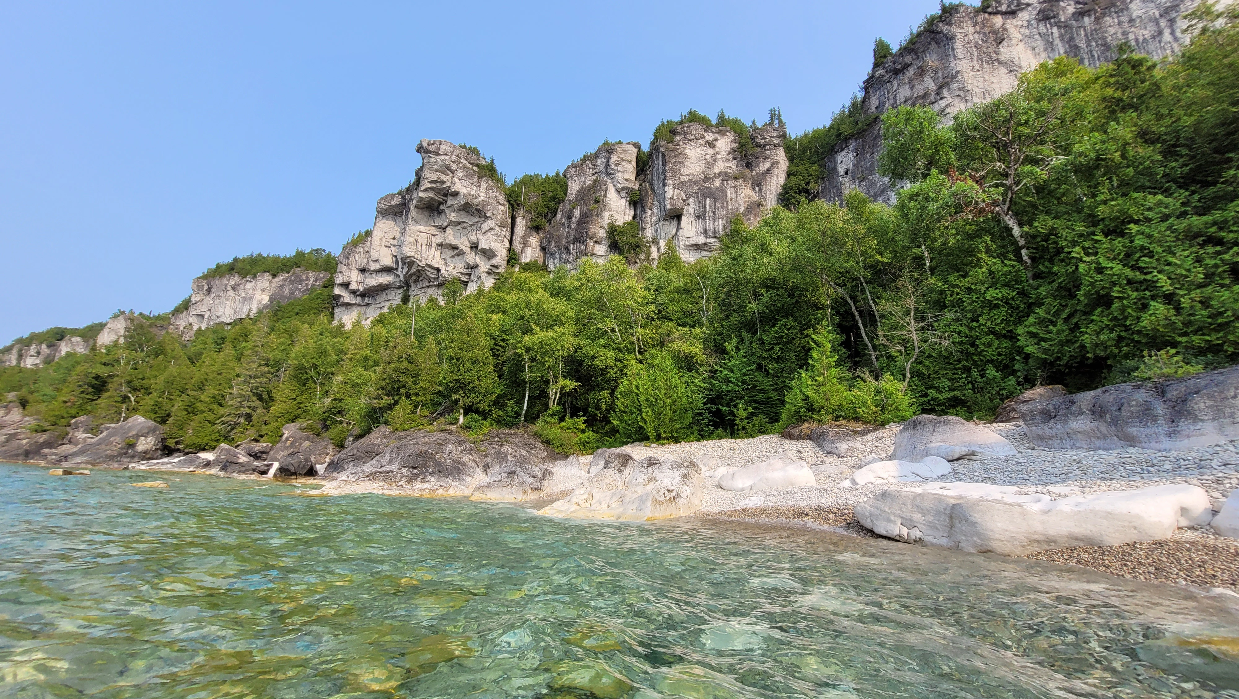 Sea kayak exploring the coastline near Lions Head on Georgian Bay