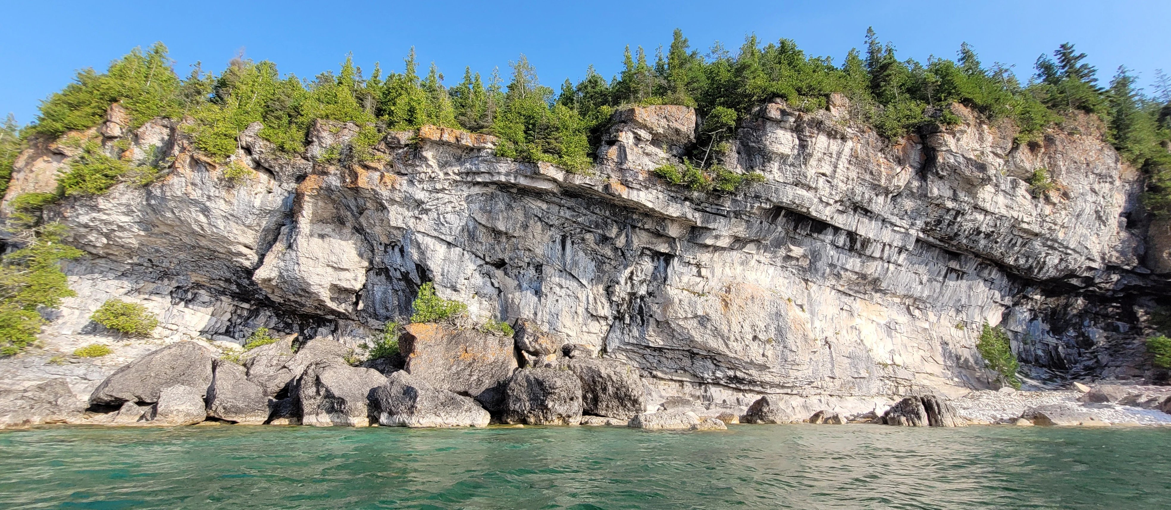 White limestone cliff in Driftwood Cove on Georgian Bay