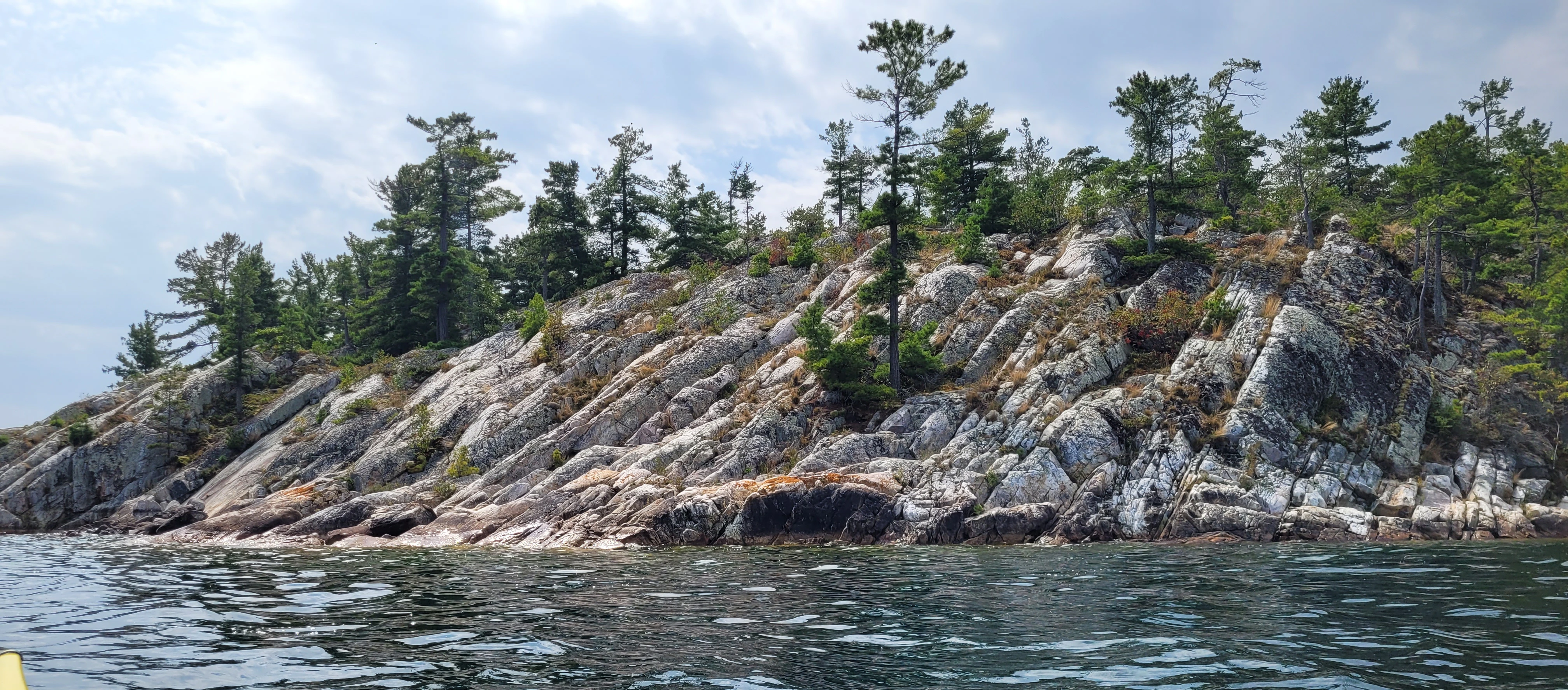 View from a kayak of the Killarney Bay's white quartzite cliffs in Killarney, Ontario, Canada