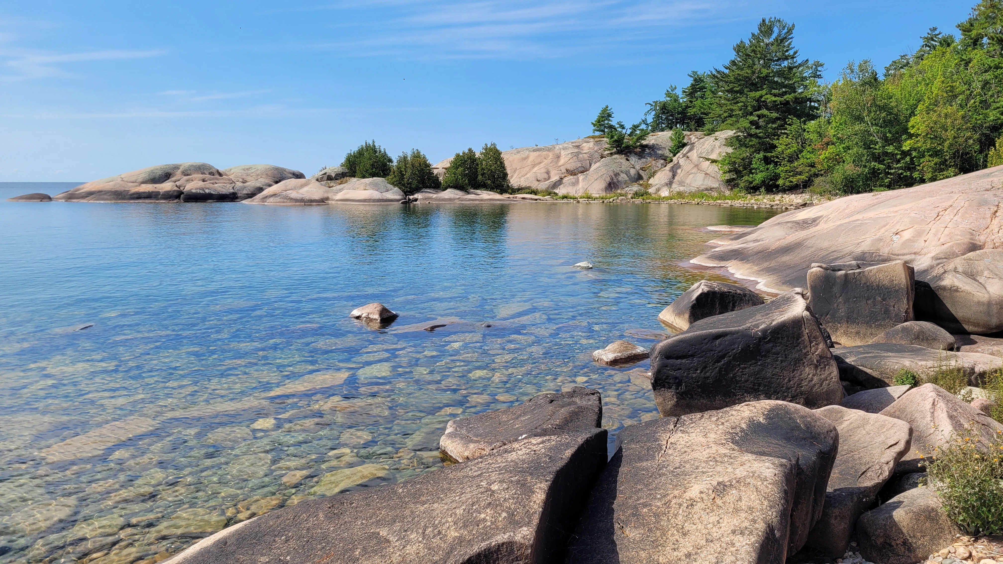 A View of crystal clear blue waters on The Georgian Bay from a cove on Martins Island