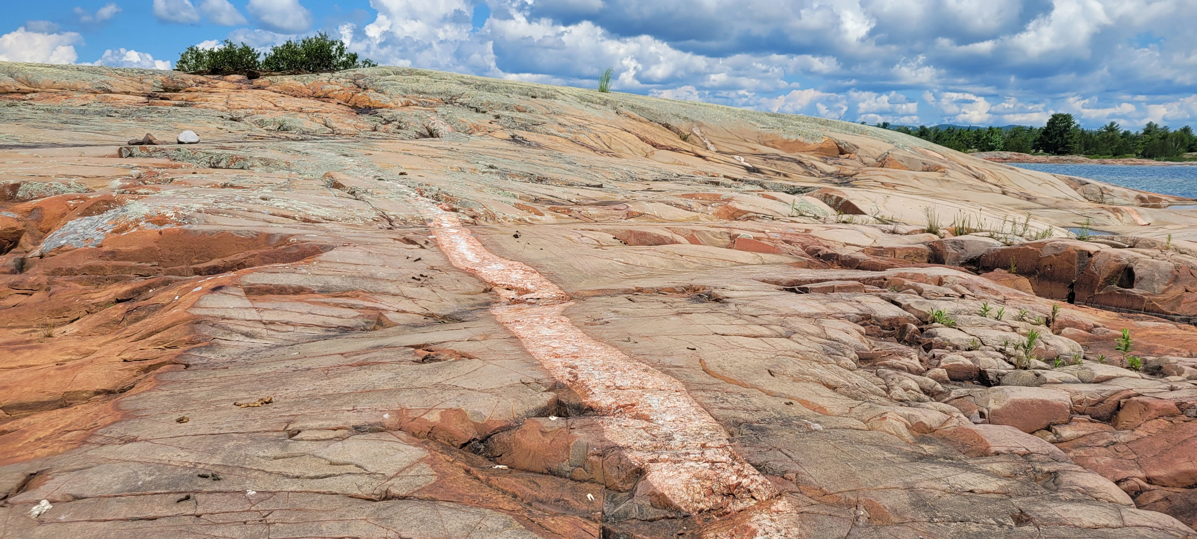 Pegmatite rock formations on an unnamed island near Phillip Edward Island Ontario Canada