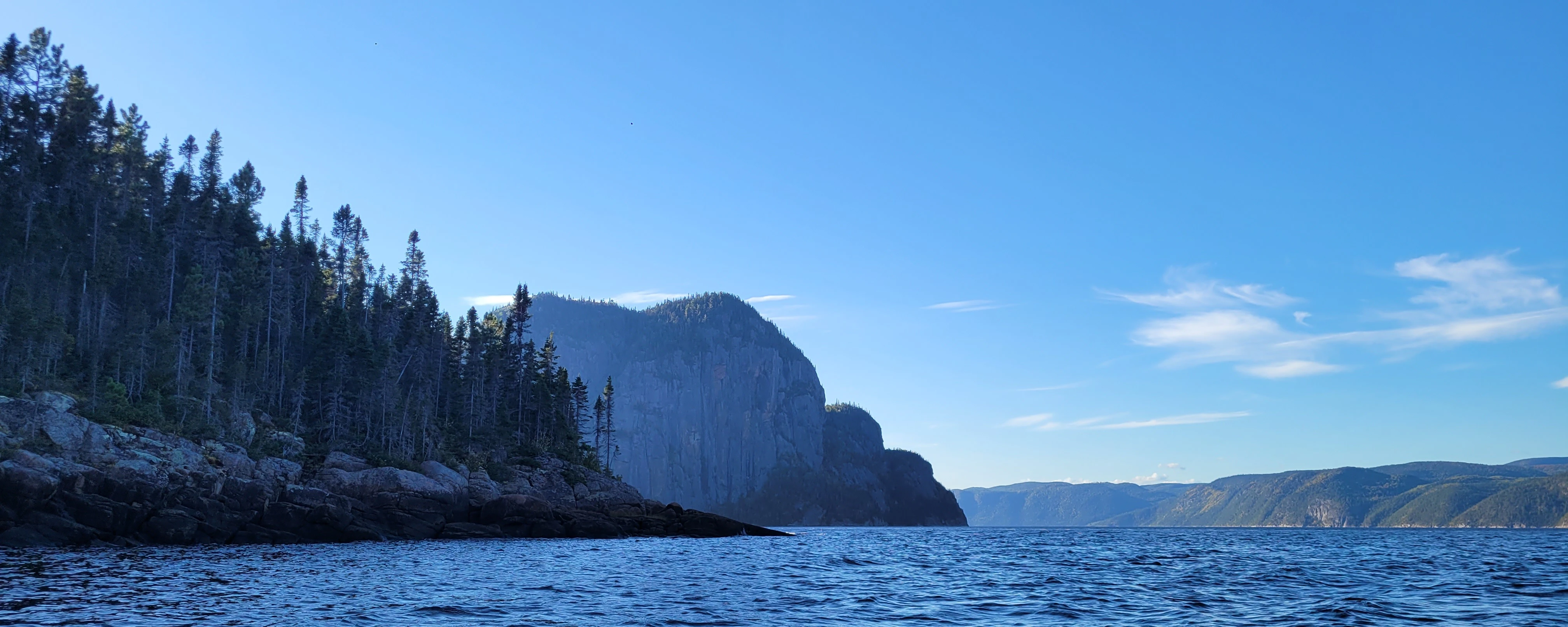 Wide angle view of the dramatic cliffs and waters of the Saguenay Fjord in Quebec Canada
