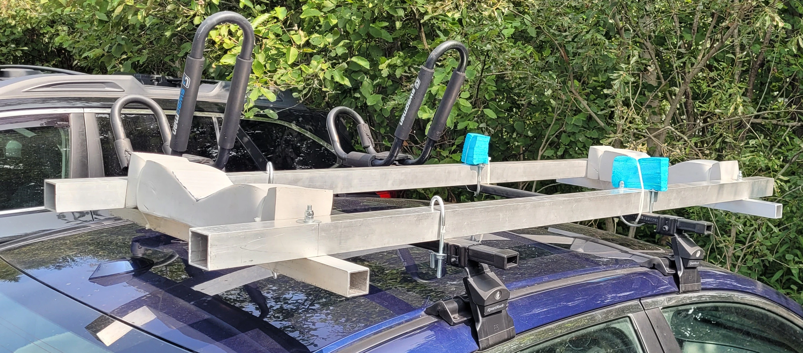 Custom built aluminum kayak rack on car