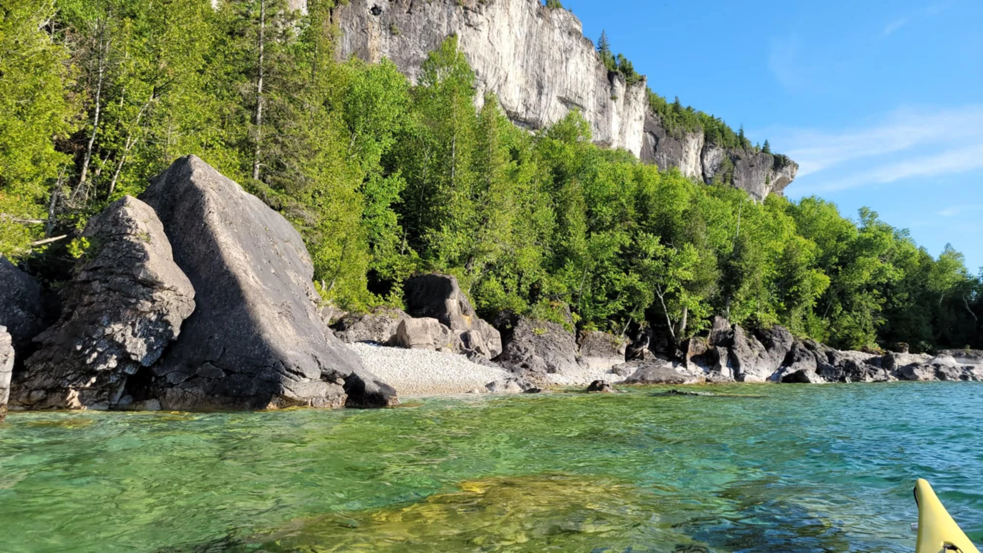 The white limestone cliffs of the Niagra Enscarpment along the shores of Lion's Head Ontario in the Bruce Peninsula