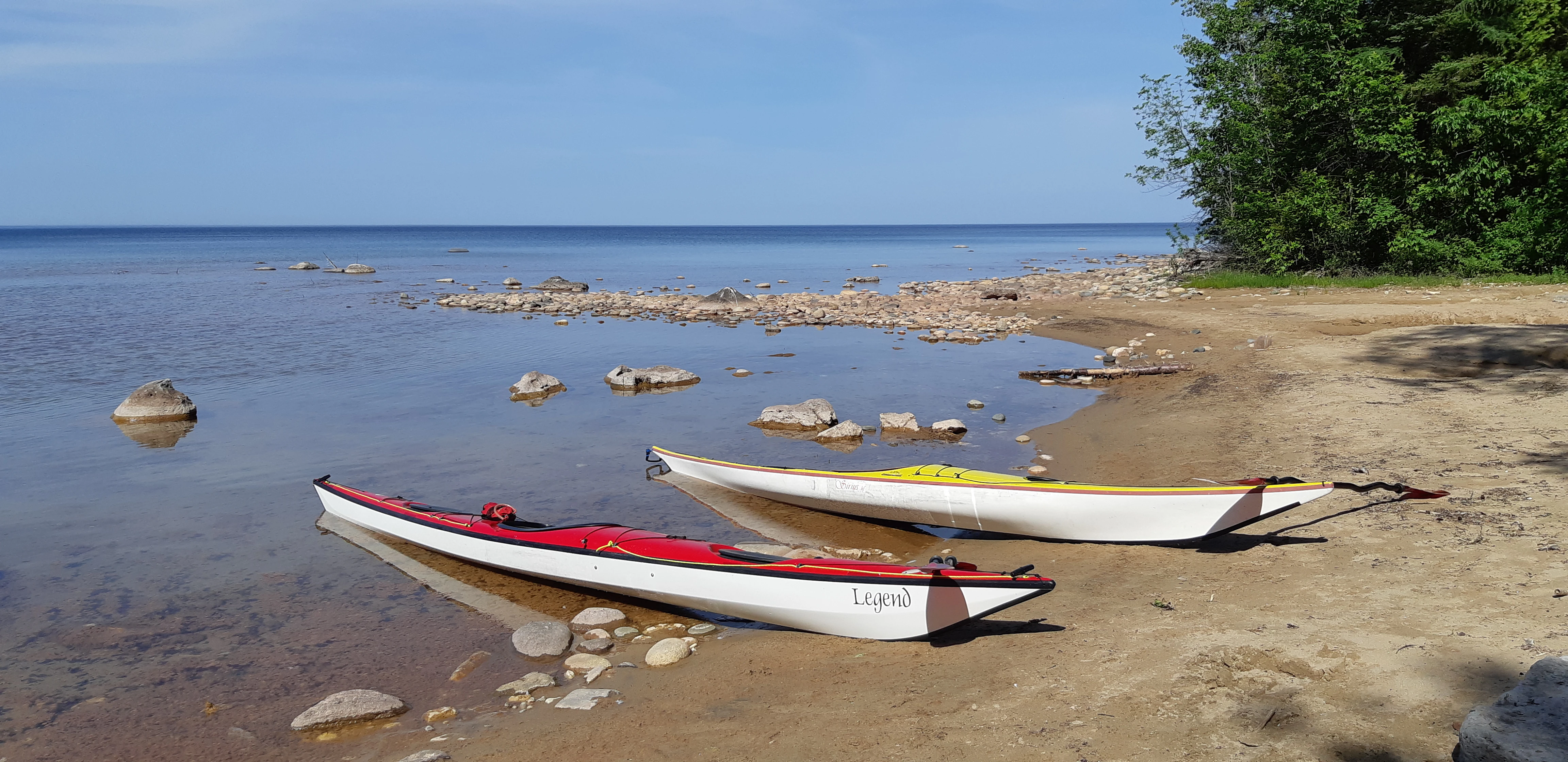 two sea kayaks beached at the edge of Lions Head Peninsula
